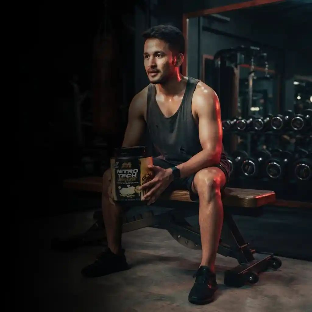 Lifter holding MuscleTech Nitro Tech Whey Protein